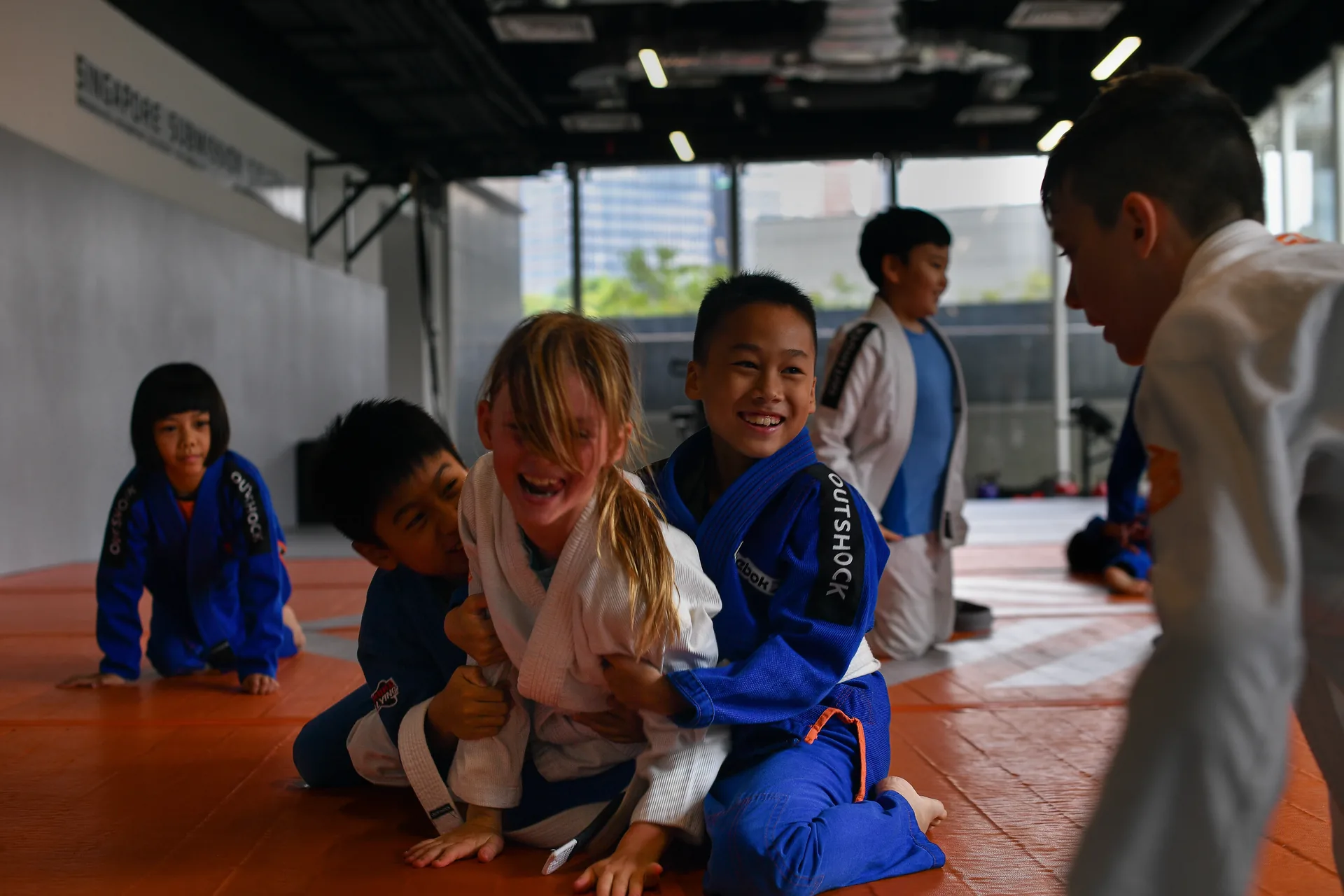 Kids laughing during BJJ class